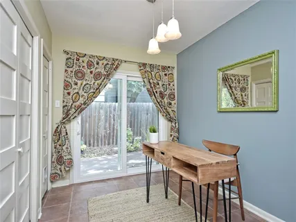 a view of a dining room with furniture