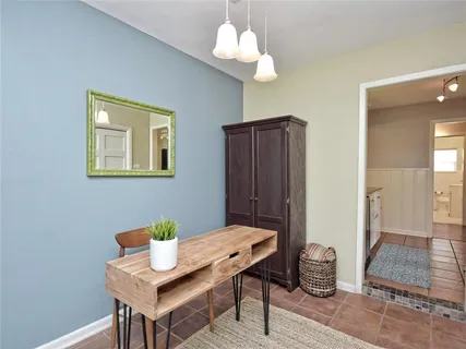 a workspace with furniture and window