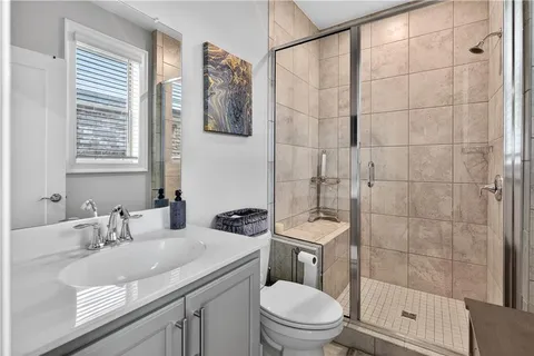 a kitchen with stainless steel appliances granite countertop a stove and cabinets