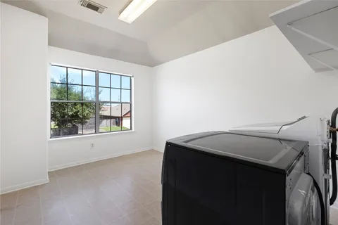 a view of a livingroom with an empty space and window