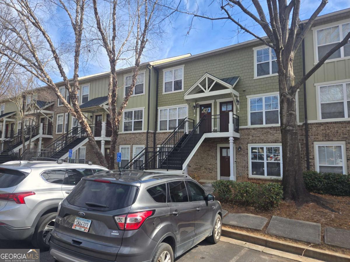 490 Barnett Shoals Road, Unit 205 Athens, GA 30605 - Photo 3 of 19 a front view of a house with parking space