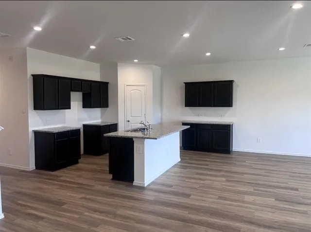 a living room with a flat screen tv and a fireplace