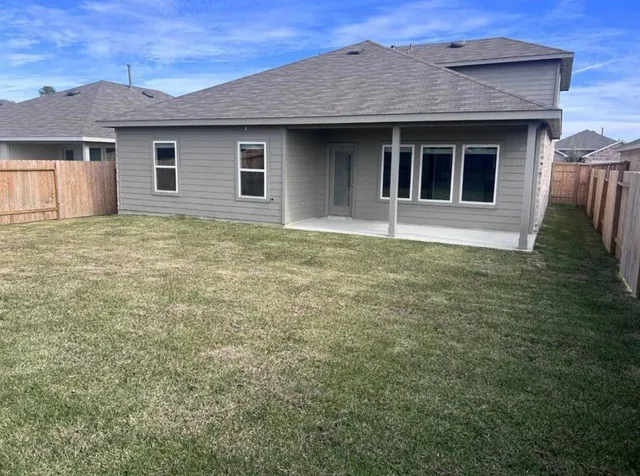 a house with yard in front of it