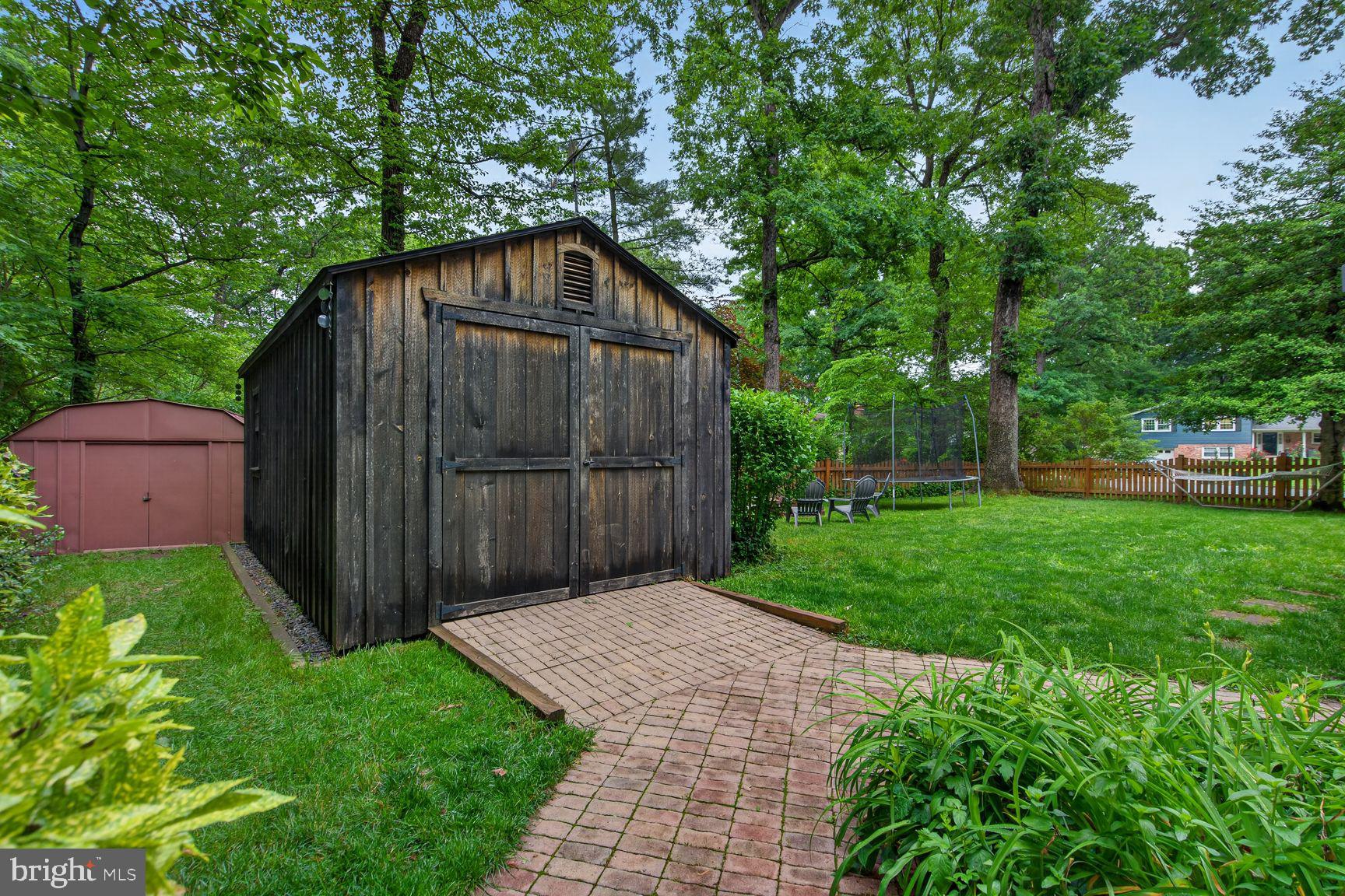 5024 Portsmouth Road Fairfax, VA 22032 - Photo 32 of 38 a backyard of a house with lots of green space