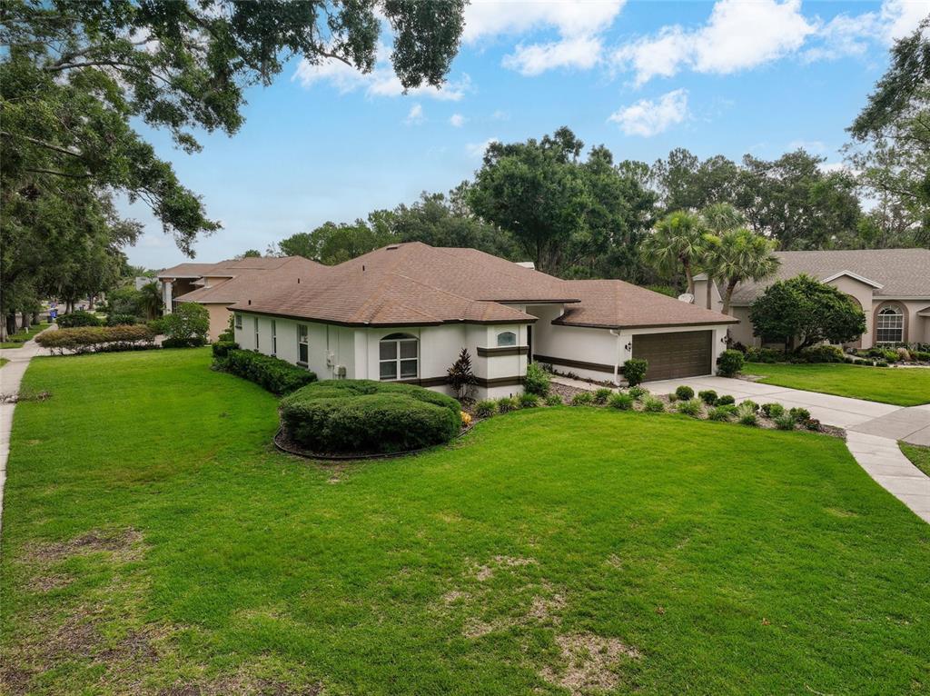 4902 Jenni Lin Court Valrico, FL 33596 - Photo 3 of 56 a view of a house with a garden
