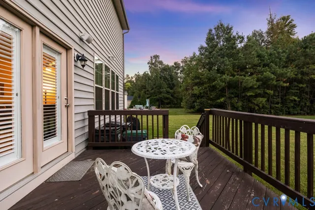 a view of a balcony with table and chairs