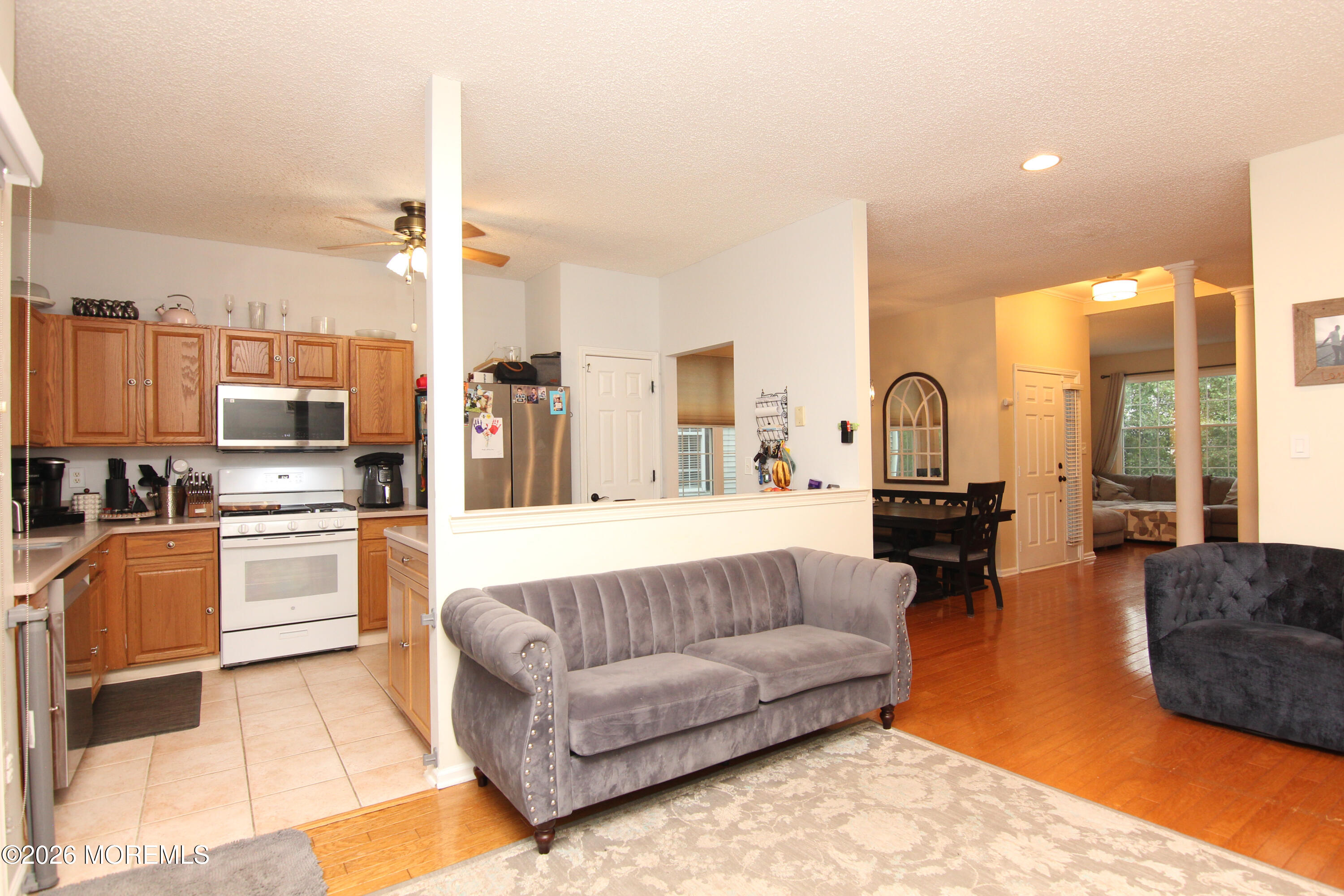 33 Austin Street Tinton Falls, NJ 07712 - Photo 41 of 46 a living room with stainless steel appliances furniture and a kitchen view