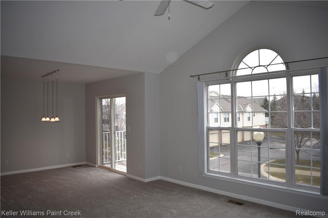 1885 Flagstone Circle Rochester, MI 48307 - Photo 16 of 32 CHECK OUT THE STYLISH WINDOWS IN THE GREAT ROOM & THE DINING ROOM DOOR WALL THAT LEADS TO THE LARGE BALCONY (6 X 9).