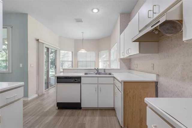 a bathroom with a glass shower door and a glass door