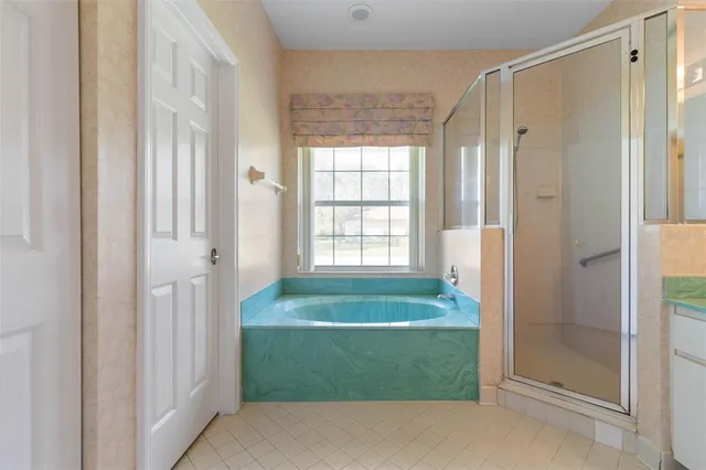 a bathroom with a double vanity sink and a bathtub