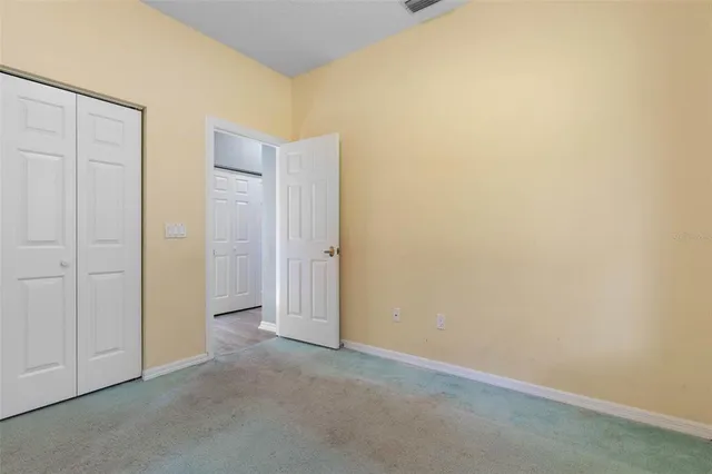a view of a storage & utility room with racks on the wall