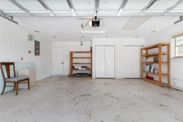 a view of an empty room with a fireplace and outdoor shower