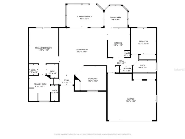 an empty room with wooden floor cabinet and windows