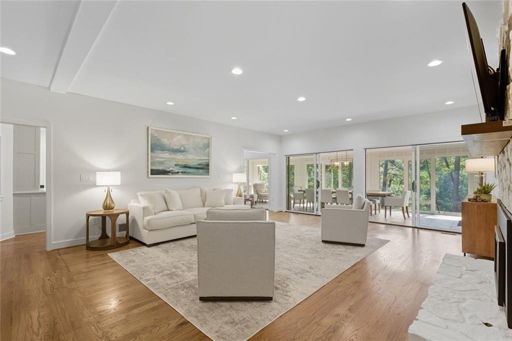 3680 Lamplighters Cove Road Gainesville, GA 30504 - Photo 14 of 88 a living room with fireplace furniture and floor to ceiling windows