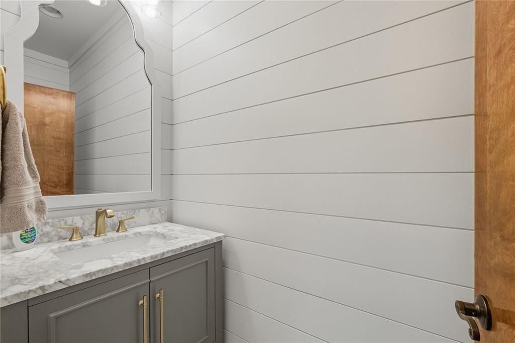 3680 Lamplighters Cove Road Gainesville, GA 30504 - Photo 16 of 88 a bathroom with a granite countertop sink and a mirror