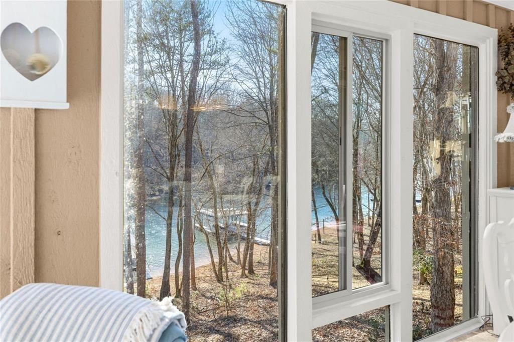 3680 Lamplighters Cove Road Gainesville, GA 30504 - Photo 19 of 88 a bedroom with a bed and a mirror