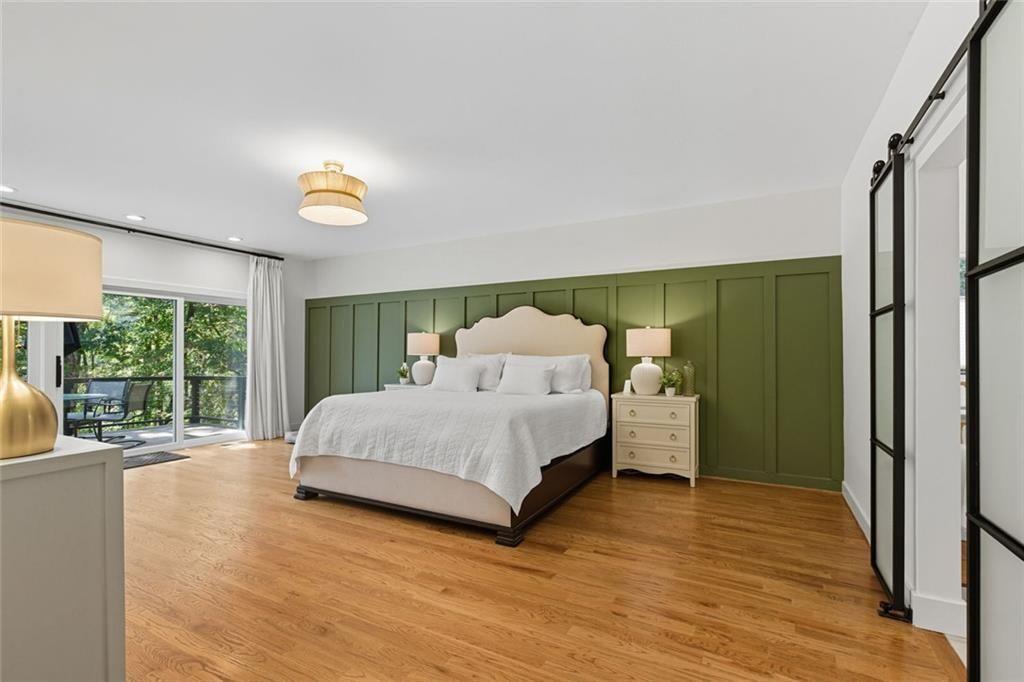 3680 Lamplighters Cove Road Gainesville, GA 30504 - Photo 28 of 88 a spacious bedroom with a bed and a large window