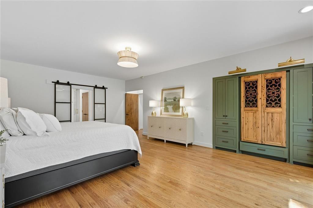 3680 Lamplighters Cove Road Gainesville, GA 30504 - Photo 29 of 88 a bedroom with a large bed and a window