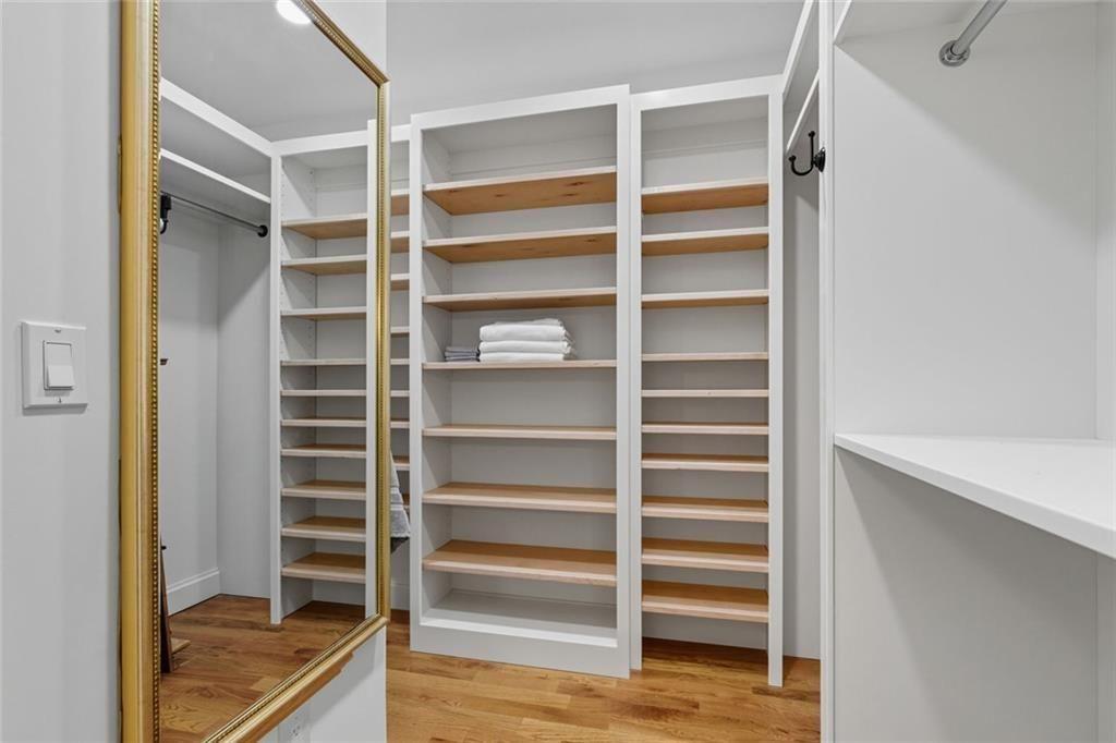 3680 Lamplighters Cove Road Gainesville, GA 30504 - Photo 33 of 88 a view of walk in closet with empty racks