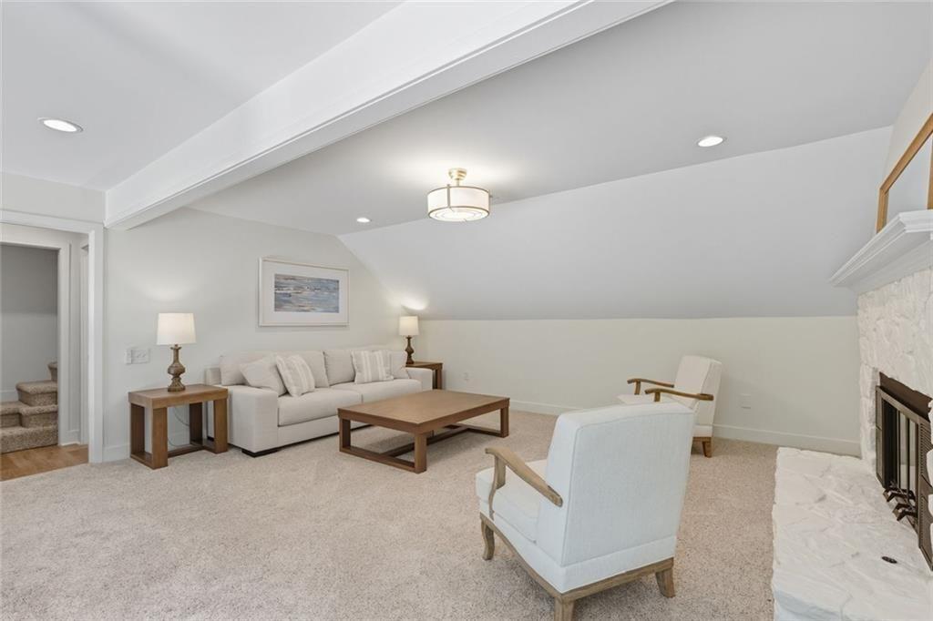 3680 Lamplighters Cove Road Gainesville, GA 30504 - Photo 35 of 88 a living room with furniture and a flat screen tv