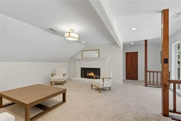 a bedroom with a bed and a large window with outer view