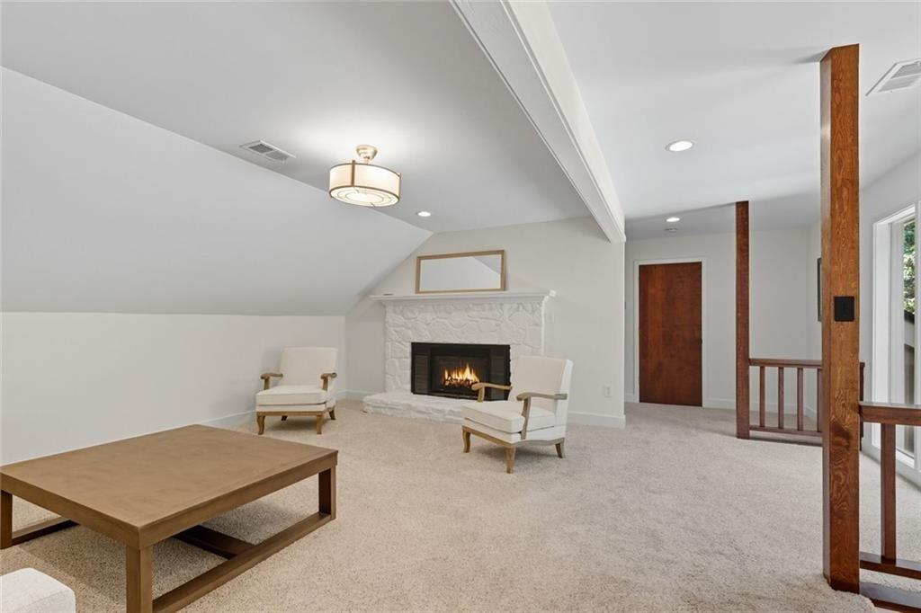 3680 Lamplighters Cove Road Gainesville, GA 30504 - Photo 36 of 88 a living room with furniture and a fireplace
