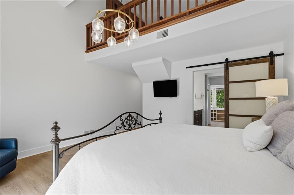 3680 Lamplighters Cove Road Gainesville, GA 30504 - Photo 43 of 88 a bedroom with a bed and a cabinets