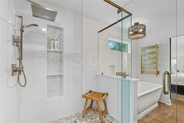 an aerial view of residential house with outdoor space and trees all around