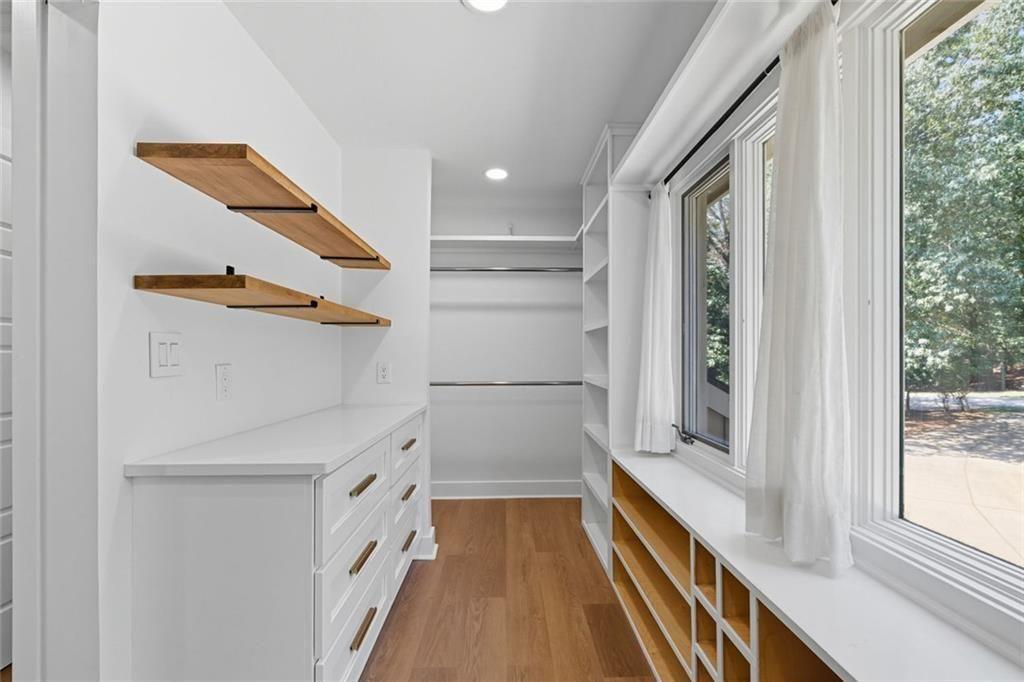 3680 Lamplighters Cove Road Gainesville, GA 30504 - Photo 49 of 88 a view of walk in closet with empty racks