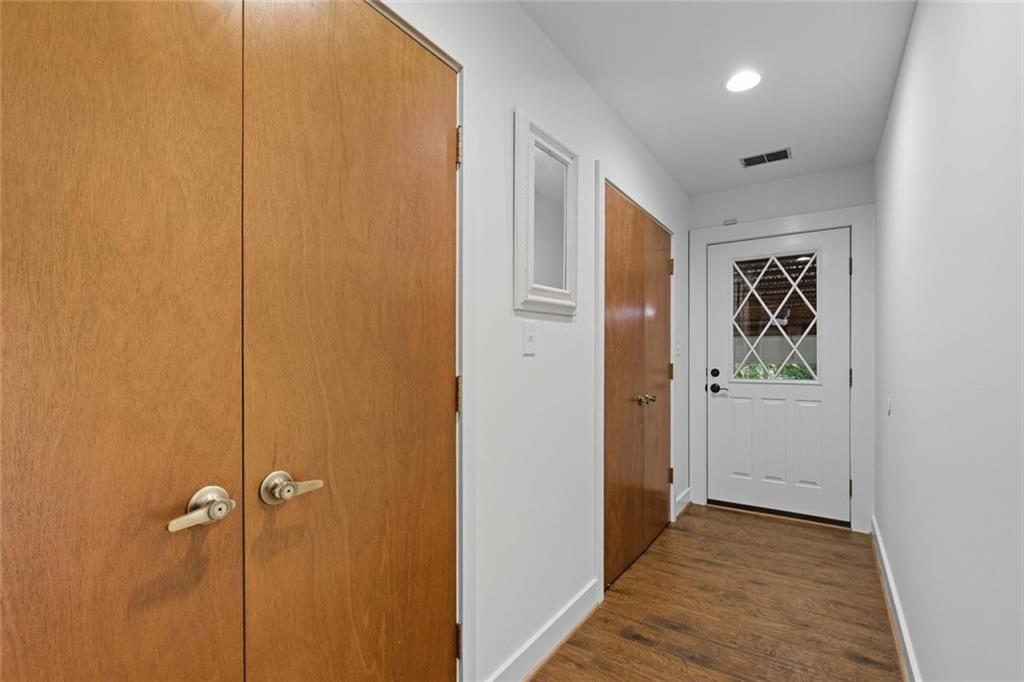 3680 Lamplighters Cove Road Gainesville, GA 30504 - Photo 60 of 88 a view of a hallway with wooden floor
