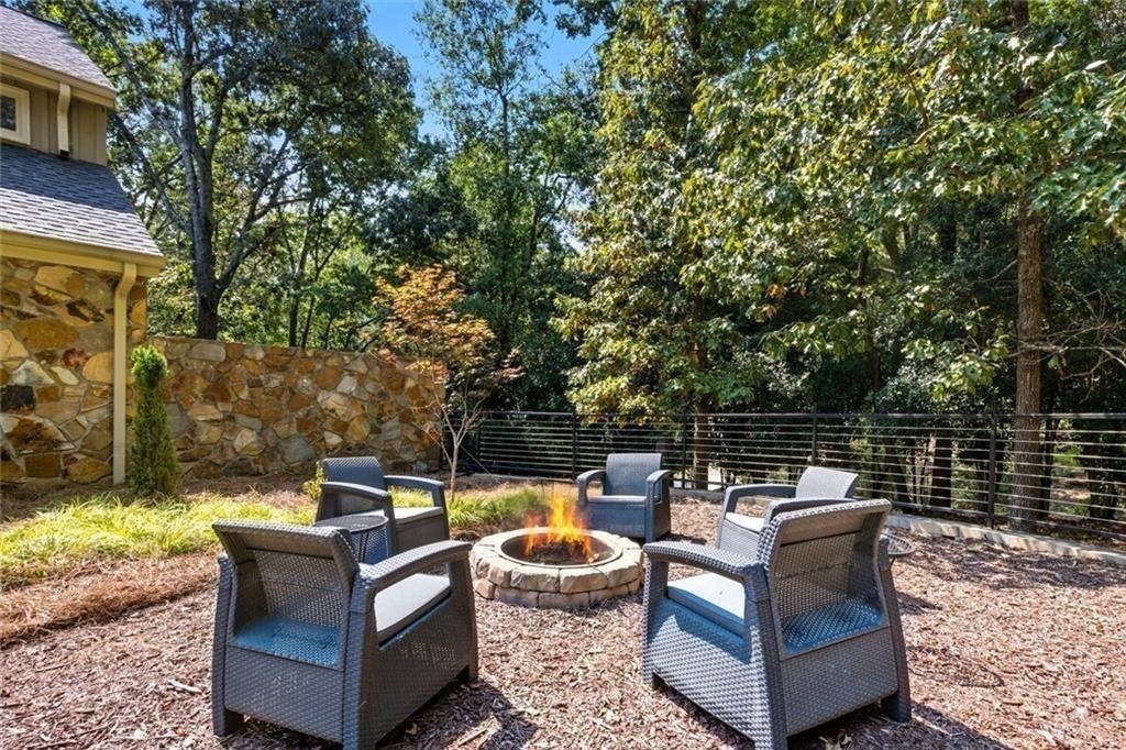 3680 Lamplighters Cove Road Gainesville, GA 30504 - Photo 68 of 88 a view of a patio with couches chairs and a fire pit