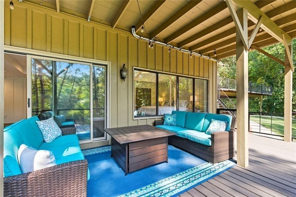 3680 Lamplighters Cove Road Gainesville, GA 30504 - Photo 72 of 88 a living room with furniture and a large window