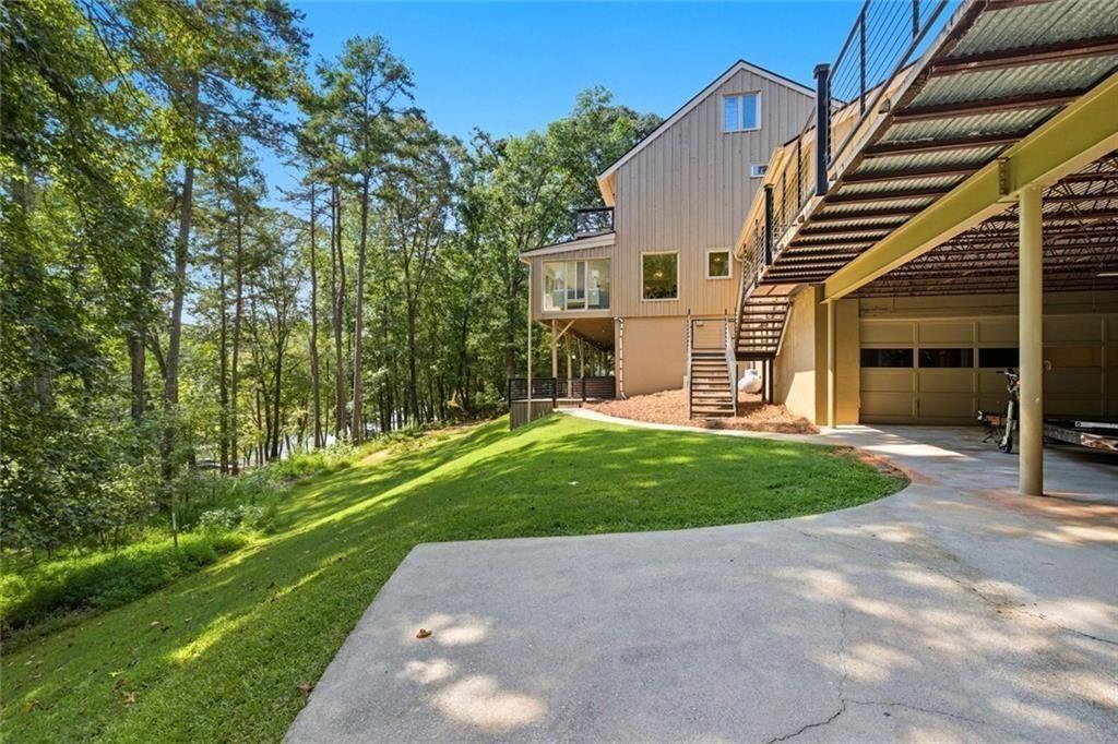 3680 Lamplighters Cove Road Gainesville, GA 30504 - Photo 74 of 88 a view of a house with a yard
