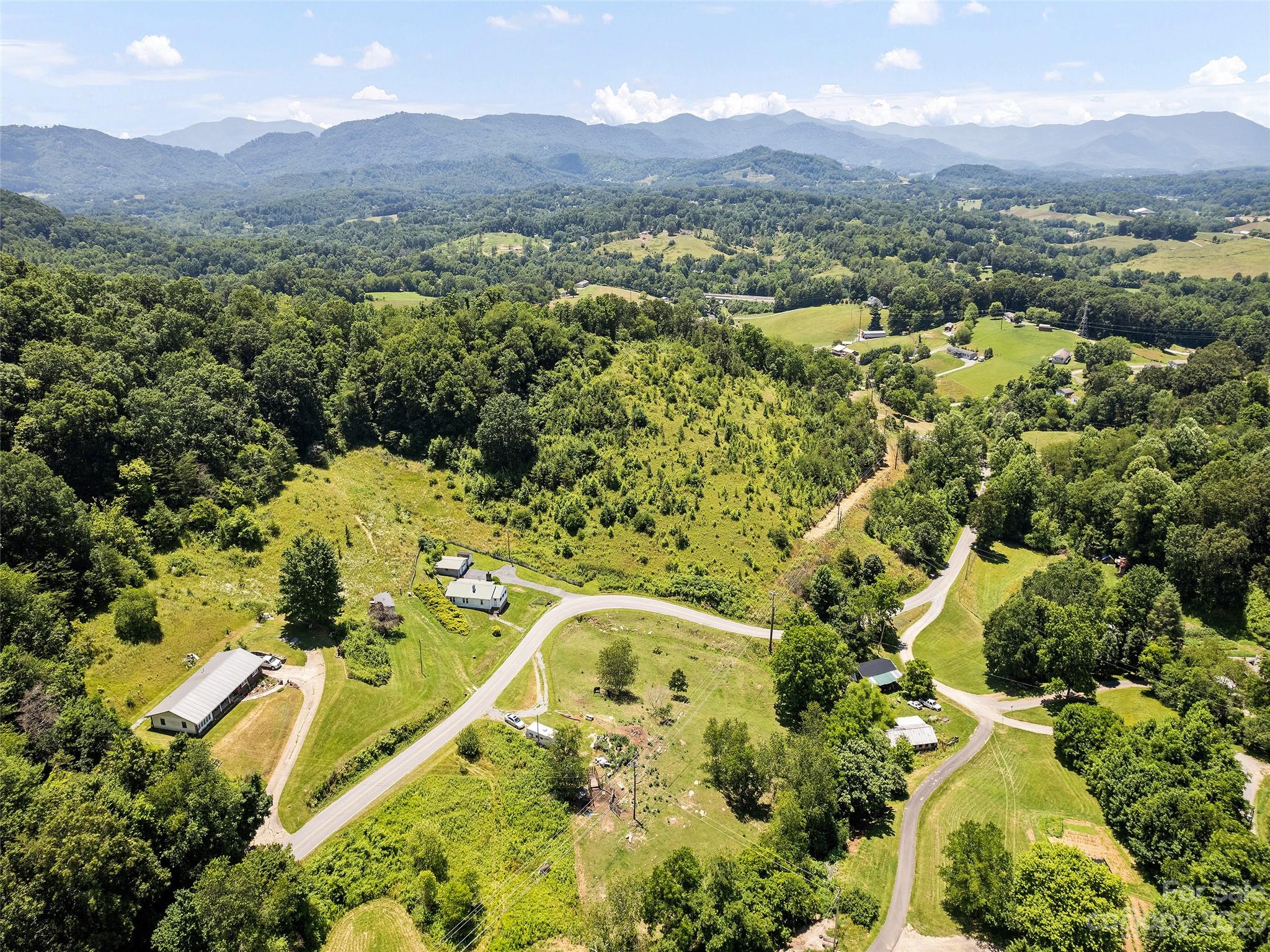 2656 Hyder Mountain Road Clyde, NC 28721 - Photo 8 of 21 an aerial view of residential houses with outdoor space and trees