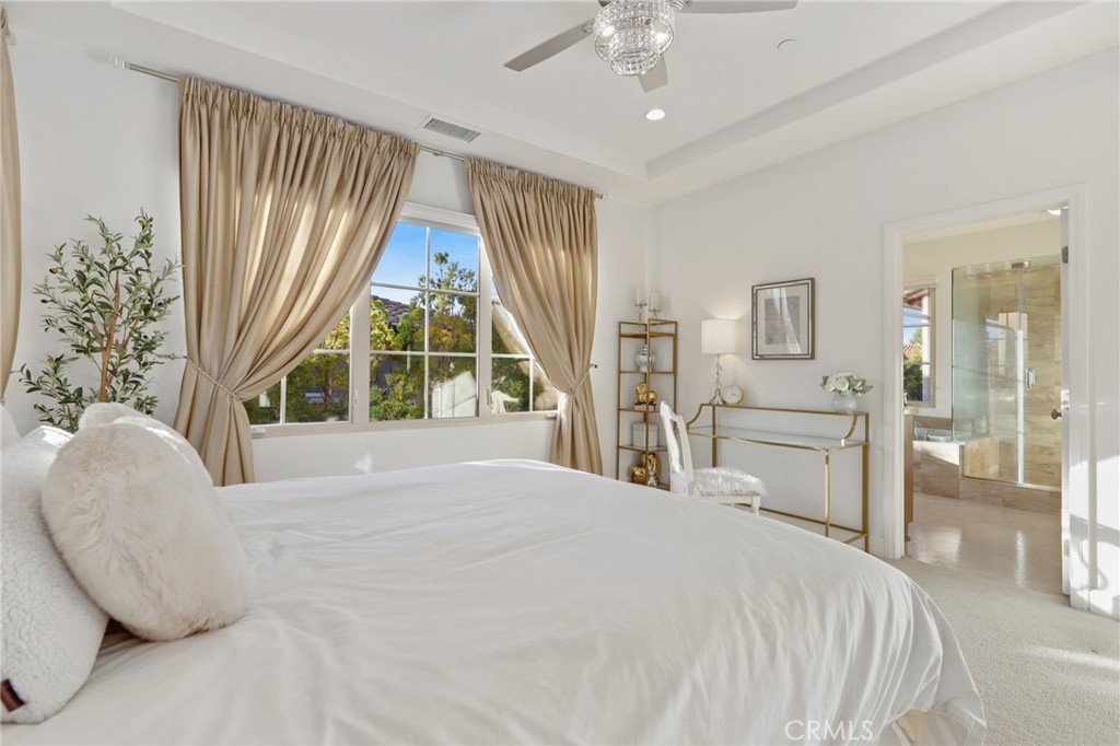 72 Brindisi Irvine, CA 92618 - Photo 22 of 48 a bedroom with a bed and a large window