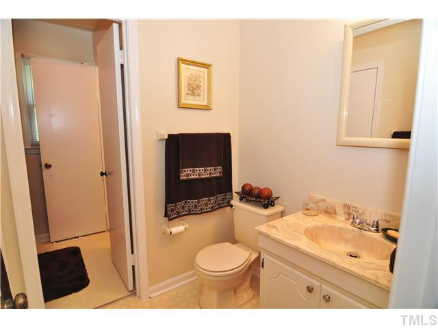 5531 McCormick Road Durham, NC 27713 - Photo 12 of 15 a bathroom with a sink toilet and a mirror