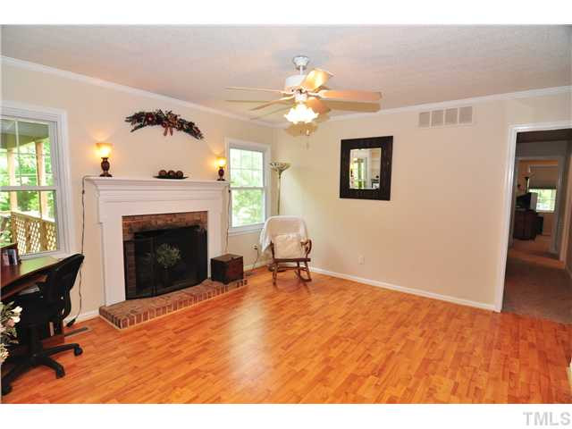 5531 McCormick Road Durham, NC 27713 - Photo 14 of 15 a living room with furniture and a fireplace