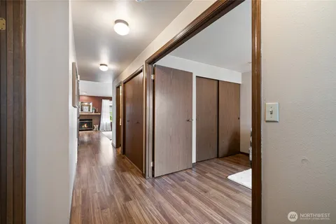 a view of hallway with wooden floor