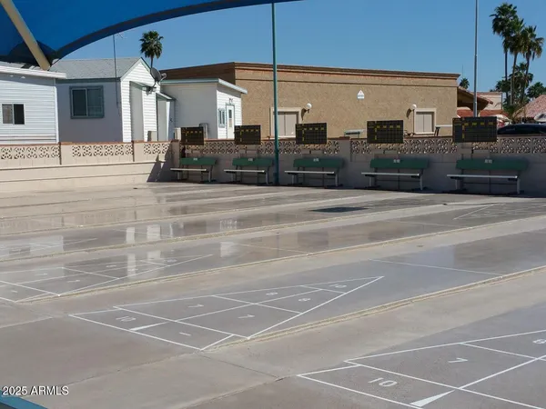 a view of a building with car parked