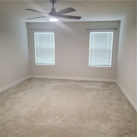 a spacious bathroom with a double vanity sink and mirror