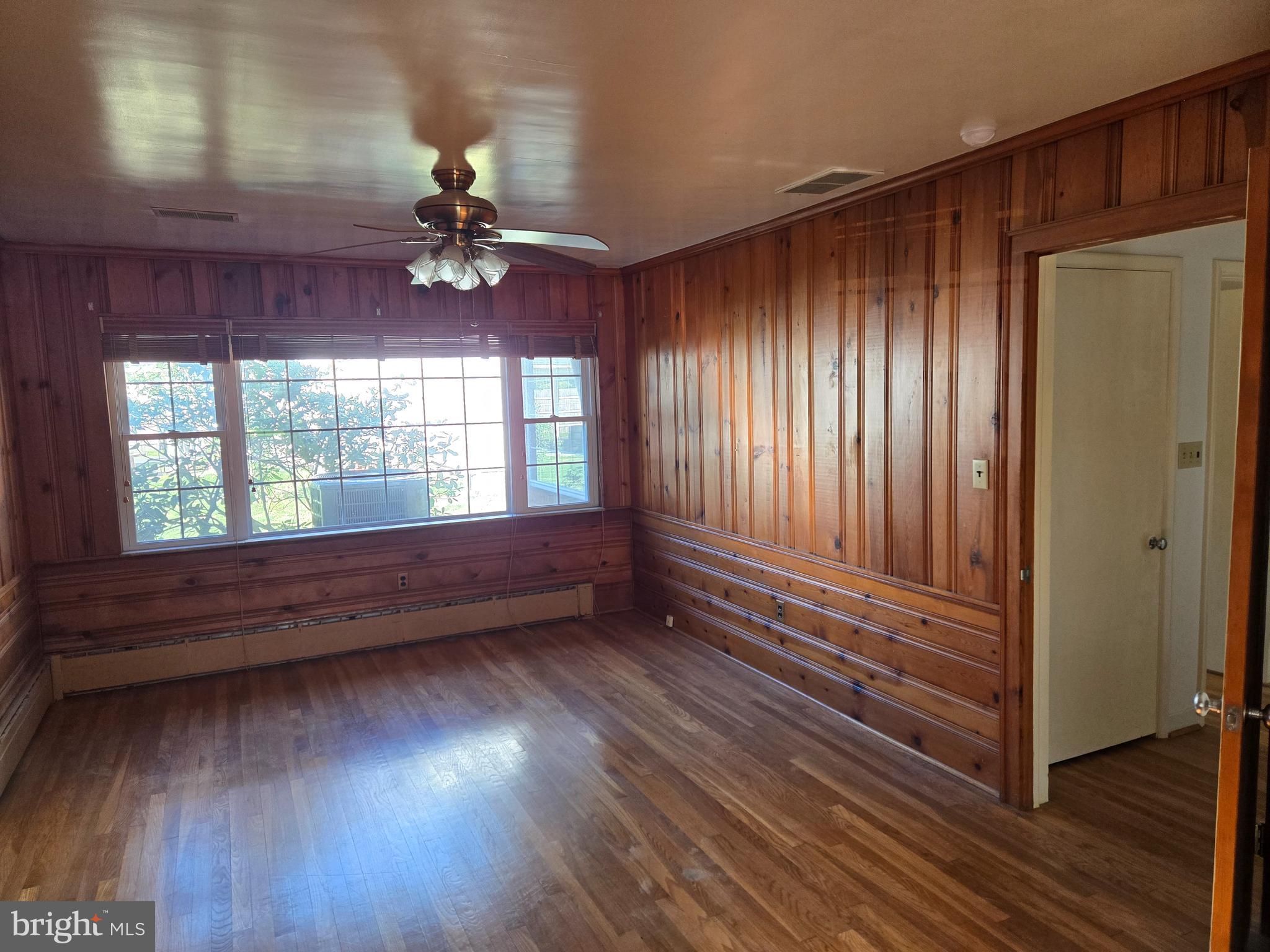 505 East Loockerman Street Dover, DE 19901 - Photo 16 of 38 wooden floor in an empty room with a window