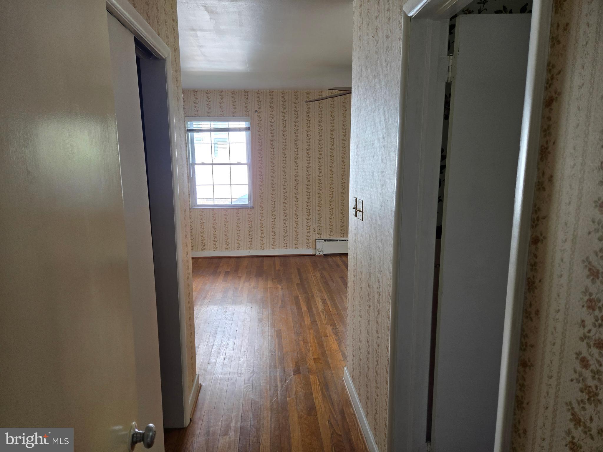 505 East Loockerman Street Dover, DE 19901 - Photo 20 of 38 a view of a hallway with wooden floor and a window