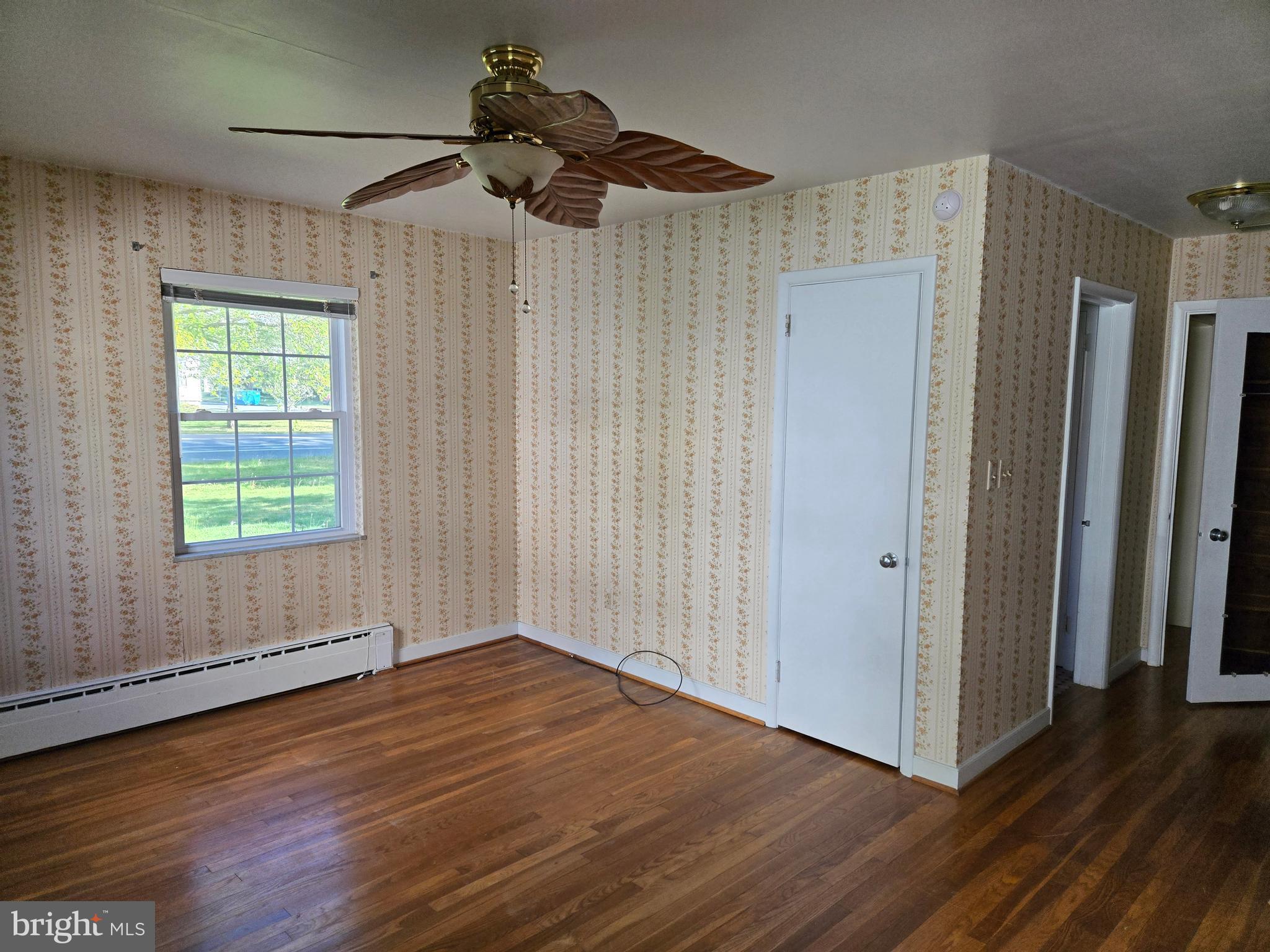 505 East Loockerman Street Dover, DE 19901 - Photo 21 of 38 a view of an empty room with wooden floor and a window