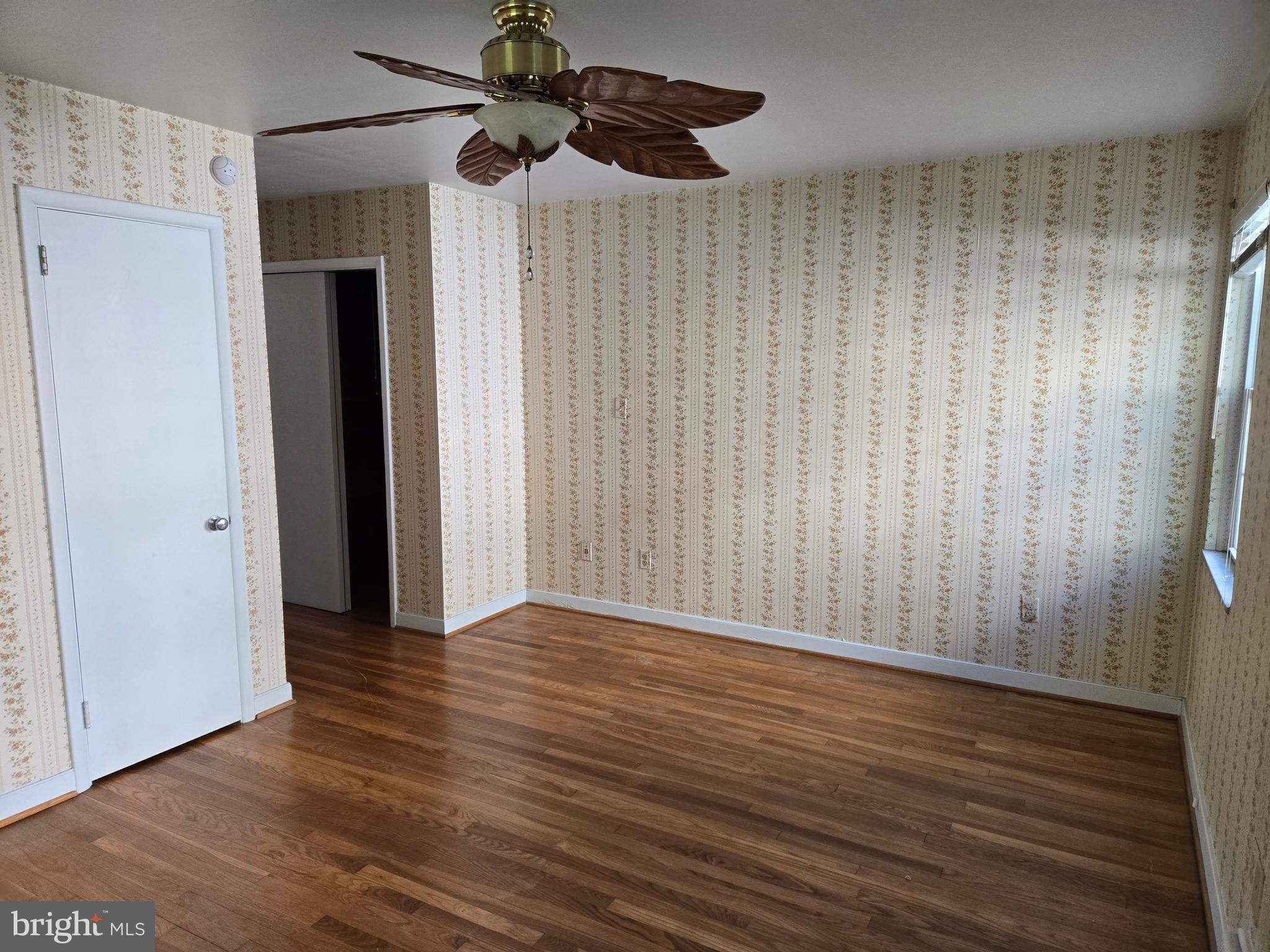 505 East Loockerman Street Dover, DE 19901 - Photo 22 of 38 a view of an empty room with wooden floor and a ceiling fan