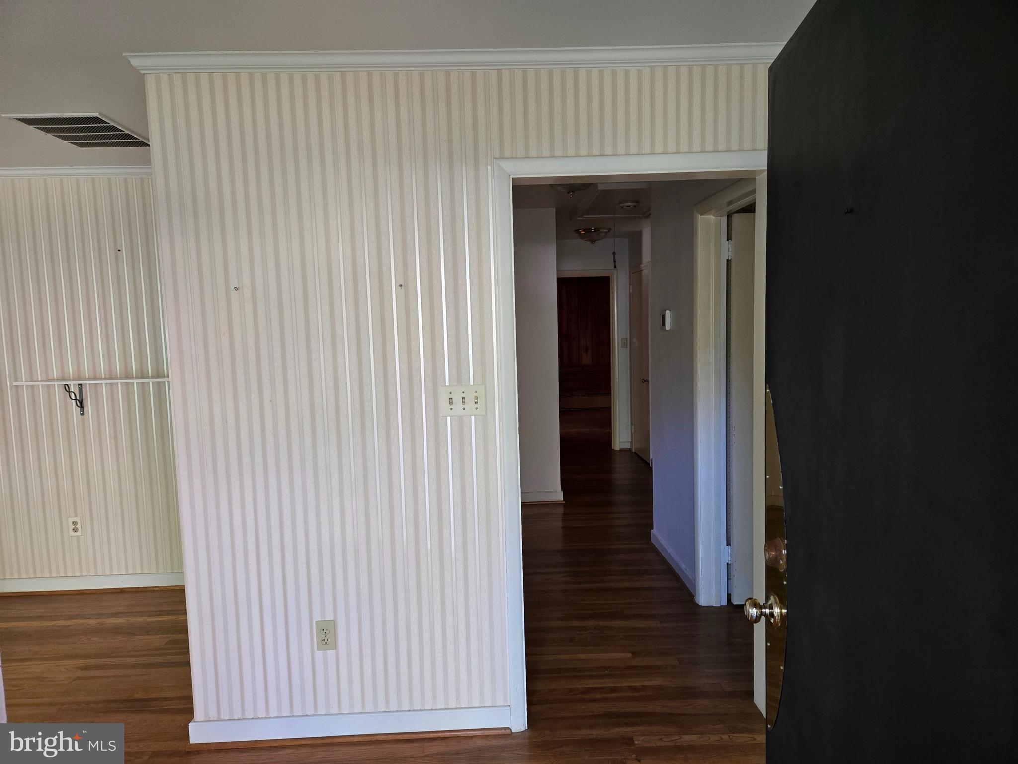 505 East Loockerman Street Dover, DE 19901 - Photo 5 of 38 a view of a hallway with wooden floor and staircase