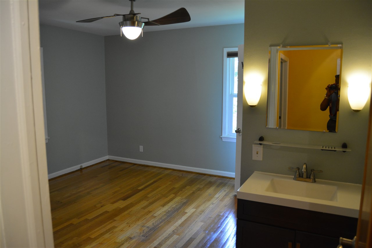 3123 Childers Street Raleigh, NC 27612 - Photo 9 of 25 Master with ensuite that features a toilet closet and shower and separate sink area. Master Bedroom