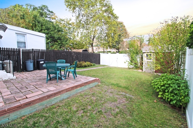 126 Baker Street Dover, NJ 07801 - Photo 11 of 11 a view of a backyard with sitting area