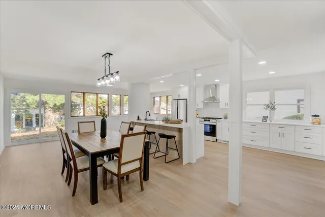 a dining area with furniture and window
