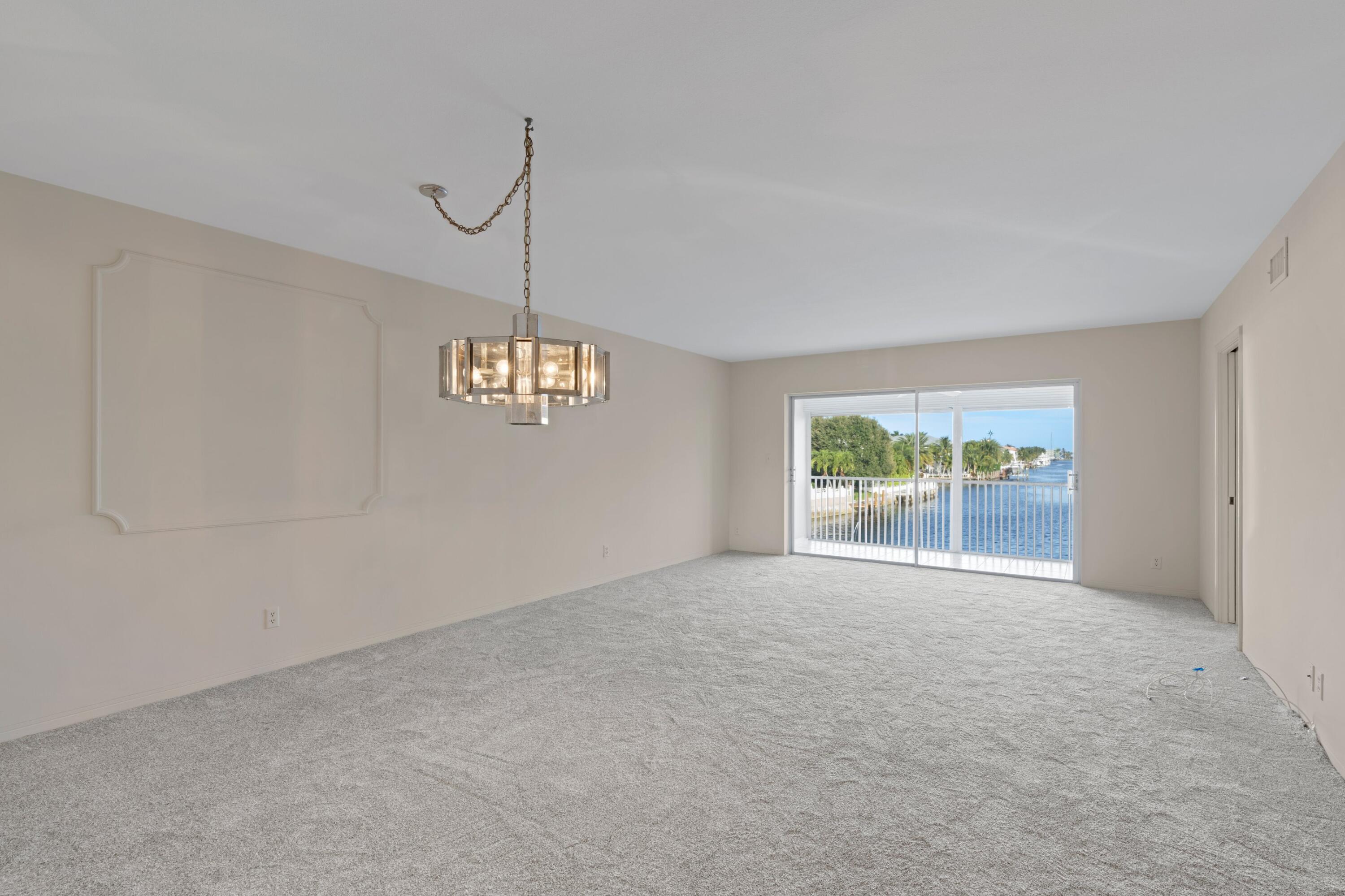 2301 Northeast 36th Street, Unit 204 Lighthouse Point, FL 33064 - Photo 6 of 20 a view of an empty room with a window