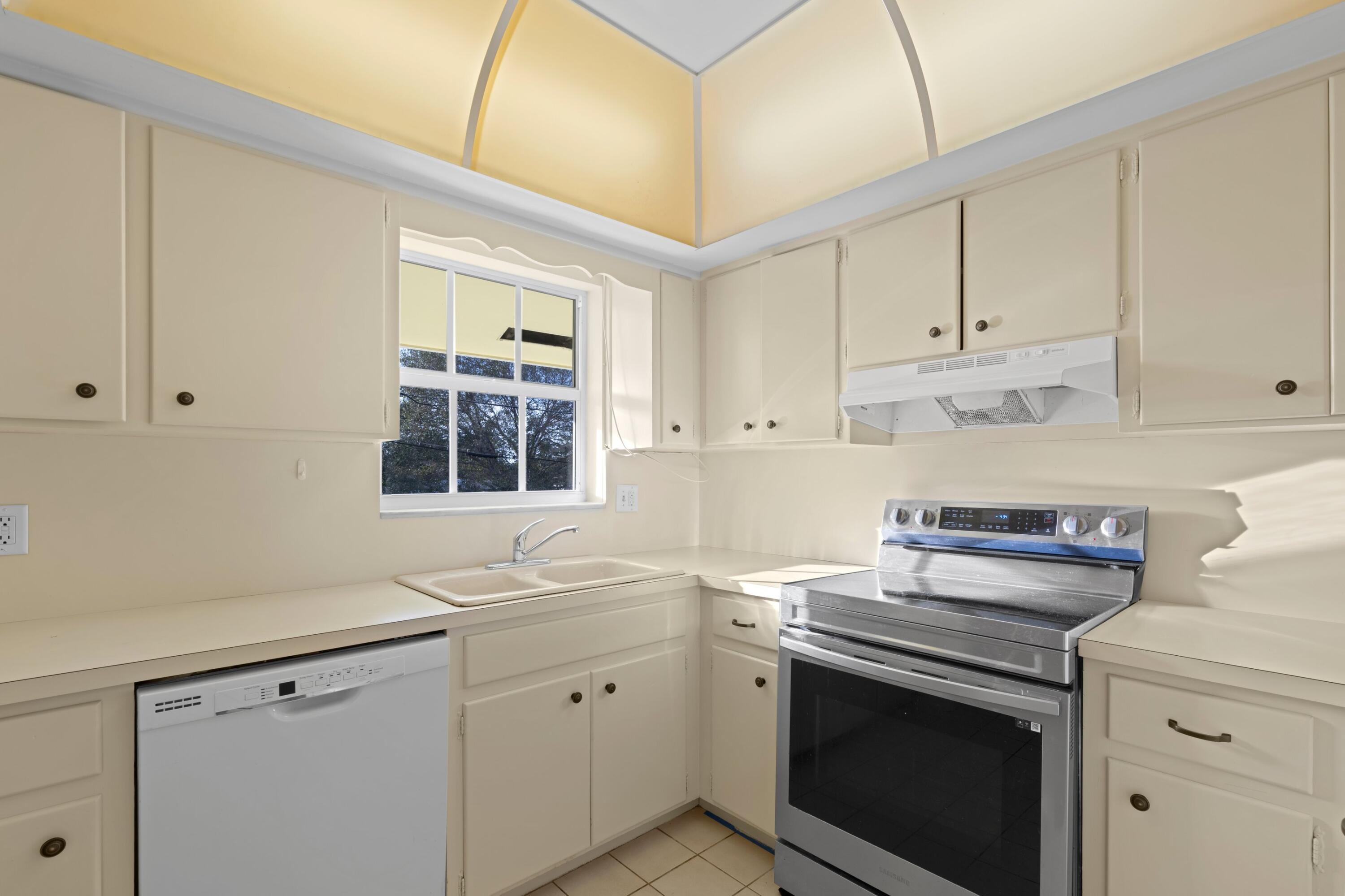 2301 Northeast 36th Street, Unit 204 Lighthouse Point, FL 33064 - Photo 8 of 20 a stove top oven sitting inside of a kitchen